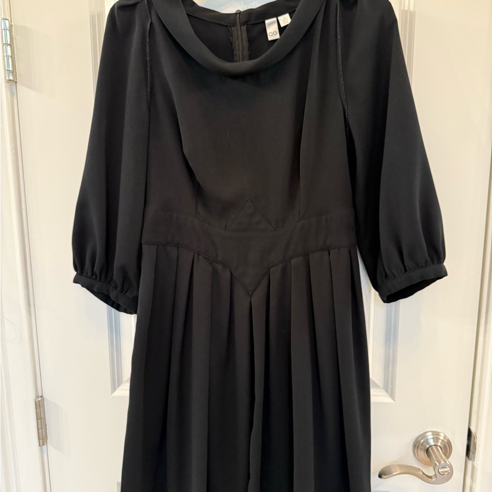 Elegant Black Dress with Pleated Skirt